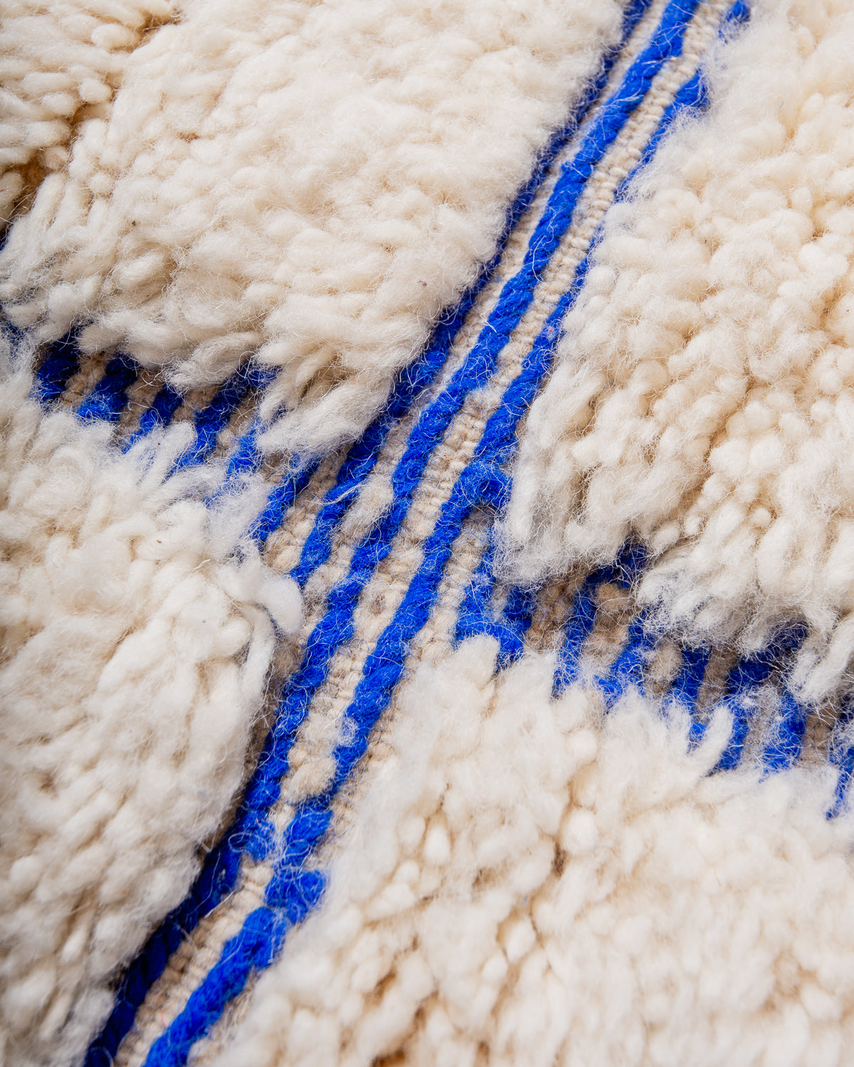 Modern, designer, handcrafted Berber rug from Morocco. Beniourain carpet with beautiful colours and patterns and fluffy wool texture.